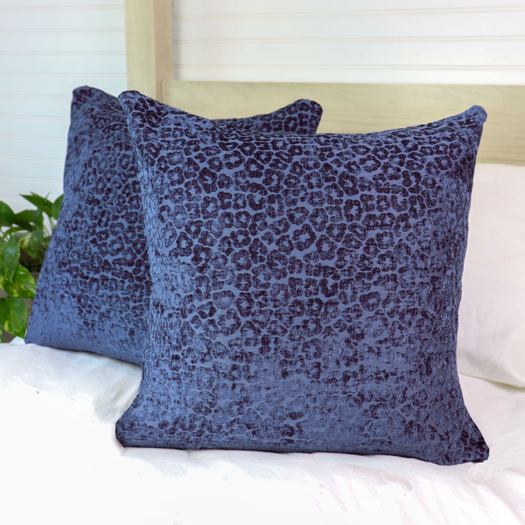https://princeandpom.com/cdn/shop/products/Navy-Blue-Leopard-Throw-Pillow-on-Bed_1445x.jpg?v=1651686892