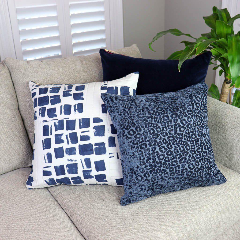 https://princeandpom.com/cdn/shop/products/white-and-navy-quilted-pillow-throw-pillows-prince-pom-899099_1445x.jpg?v=1632499752